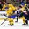 BUFFALO, NEW YORK - JANUARY 2: Sweden's Timothy Liljegren #7 gains control of the puck while being chased by Slovakia's Milos Roman #26 during the quarterfinal round of the 2018 IIHF World Junior Championship. (Photo by Andrea Cardin/HHOF-IIHF Images)

